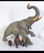 A group of African animals to include a large fibreglass elephant,