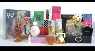A collection of vintage and modern designer perfumes and bottles to include Madonna Marc Jacobs etc.
