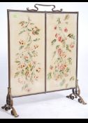A large early 20th century Arts & Crafts brass and bevelled glass fire screen.