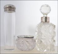 A silver ladies perfume bottle with cut glass being hallmarked for Robert Pringle & Sons, London.