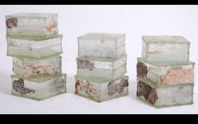 A collection of ten 20th century reclaimed glass bricks the bricks having a ripple effect finish.
