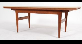A fantastic Danish modern mid 20th teak wood century metamorphic coffee / dining elevation table.