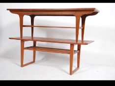 A retro 1970's teak coffee table of rectangular form together with another similar but of angular