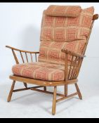 A contemporary Ercol 741 pattern Windsor armchair with good contemporary cushions to the beech and