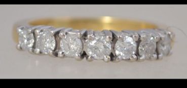 A hallmarked 18ct gold 7 stone diamond ring. Total diamonds approx 50pts. Weight 4.5g. Size O.
