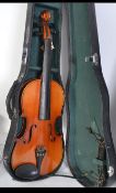 A cased Chinese made Skylark violin along with a cased eight string mandolin.