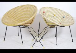 A set of 2x retro interior vinyl wicker and metal based chairs along with a magazine rack and coat