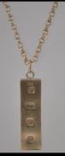 A hallmarked 9ct gold ingot pendant on chain. Ingot hallmarked Edinburgh chain hallmarked London.