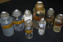 A good group of 8 antique Chemist / Apothecary bottles with paper labels.