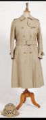 A Burberry ladies raincoat together with a Burberry rain hat and a Burberry ladies waistcoat -