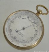 A leather cased pocket barometer with silvered dial in brass case marked for Primavesi of