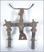 A 20th century large brass bath tap mixer with shower connection. Measures: 34cms high.