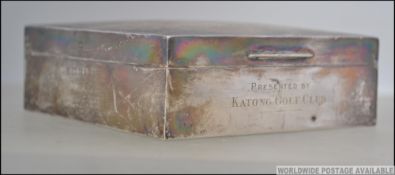 A silver hallmarked wooden lined desk cigarette box having engine turned design with AJN 1936 (