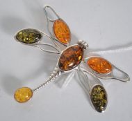 A silver and amber set ladies dress brooch in the form of a large dragonfly. Weight 13.
