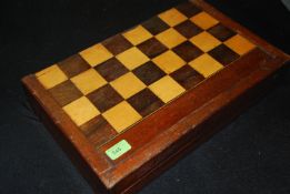 An 19th century Victorian mahogany games box with a large quantity pieces to include gaming pieces