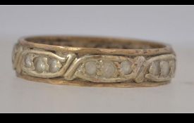A 9ct gold eternity ring set with clear stones. Marked 9ct tests 9ct gold. P.5. Weight 3g.