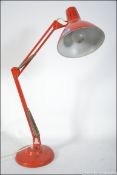 A retro 1001 anglepoise desk lamp in original orange paint having applied label.