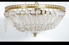 An early to mid 20th century empire gilt metal and cut glass empire chandelier with single electric