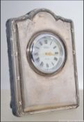 A silver miniature hallmarked easel clock by Robert Carr. Sheffield hallmarks for 1996.