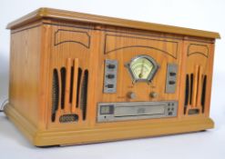A contemporary vintage style hi-fi with wooden effect case having record deck,