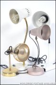 A group of 4 anglepoise lamps to include an anglepoise 99 an articulated metallic rose gold example