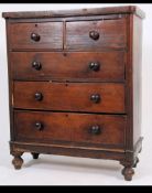 A Victorian mahogany 2 over 3 chest of drawers being raised on bun feet with bun feet and flared