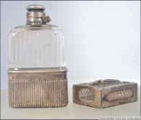 A silver and cut glass ( tested ) believed Siam silver match vesta cast in relief with deity.