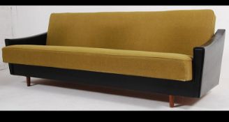 A 1950's Danish influence sofa day bed in the manner of Scandart having two tone fabric upholstered