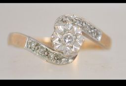 A hallmarked 9ct gold diamond crossover ring with single diamond in a star setting. Size K.
