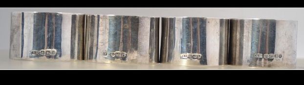 2 sets of 2 silver napkin rings . Ovoid set marked Sheffield 1936 E.
