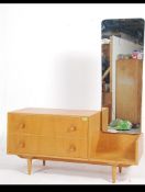 A light oak mid 20th century dressing table having a bank of two long drawers with an offset drop