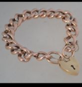 A 9ct gold chain link bracelet with later 9ct gold heart lock. Lock hallmarked London.