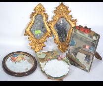 A collection of mirrors to include easel barbola mirror together with another, rococo wall mirrors,