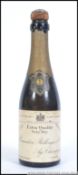 A vintage 20th century half bottle of Extra Quality Very Dry Renaudin Bollinger & Co Champagne.