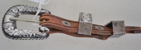 A Mexican sterling silver and tooled leather belt.
