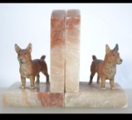 A pair of 20th Century alabaster bookends. A good vintage lot with cold painted Corgi dogs.