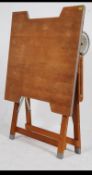 A superb 20th century vintage industrial metamorphic folding architects / draughtsman's table.
