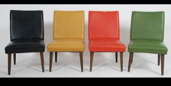 A group of four vintage / retro 20th century Lounge chairs each upholstered in a different colour