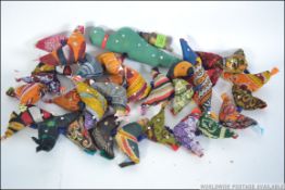 An unusual possibly South American in origin mobile / wall hanging of needlework stuffed birds,