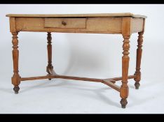 A Victorian country oak library writing desk table with single drawer to the frieze having planked