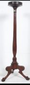 A 19th Century Regency large mahogany torchere having 3 splayed claw feet with acanthus leaf