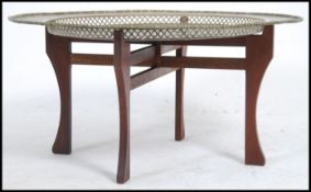 A Chinese brass opium table and stand engraved with Good Luck and Happiness symbols (Dragon, Turtle,
