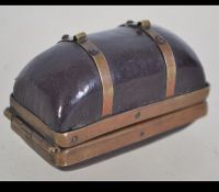 A 19th century leather and brass bound cased Geschutzt thimble case with inset thimble and thread