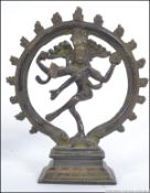 An early 20th century Bronze statue of Nataraj Dancing Shiva Statue Royalty within halo and raised