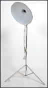 A 1970's retro pendant lamp on tripod stand.