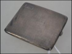 A silver hallmarked engine turned cigarette case.