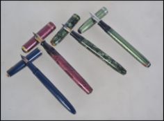 A good collection of four mid 20th century fountain / ink pens.