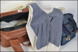 A collection of bowling accessories to include bowling balls, 2 bowling bags, waistjacket,