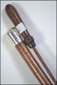 A silver topped swagger stick with notation OBP 41st Regt together with a 19th century rifle