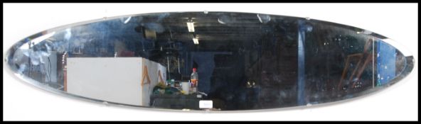 A 1950's Halls ' Galvo ' oval - marquise wall mirror having bevelled edges with black plinth base